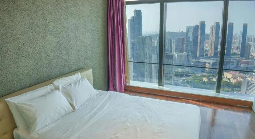 Bed in Grand Madison Qingdao Harbour-view Central（Former Qingdao Farglory Hotel）