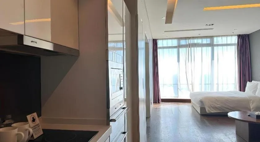 Bed in Grand Madison Qingdao Harbour-view Central（Former Qingdao Farglory Hotel）