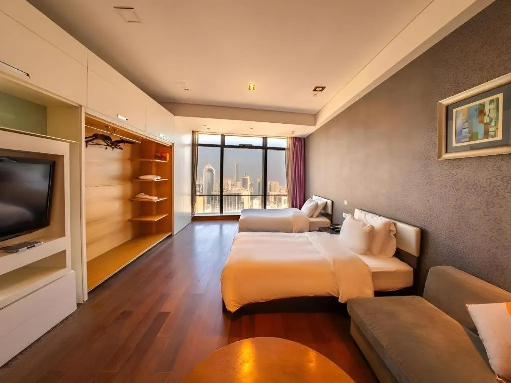 Bed in Grand Madison Qingdao Harbour-view Central（Former Qingdao Farglory Hotel）