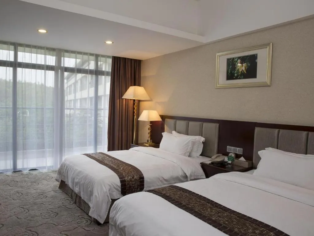 Bed in Kecheng Holiday Hotel