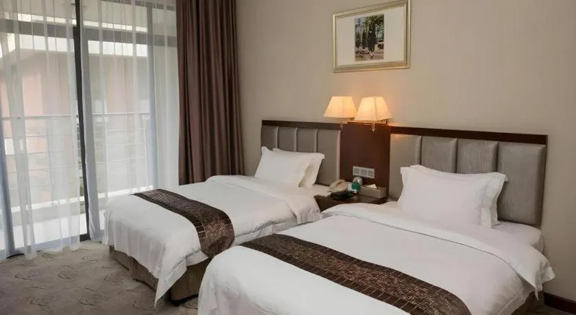 Bed in Kecheng Holiday Hotel