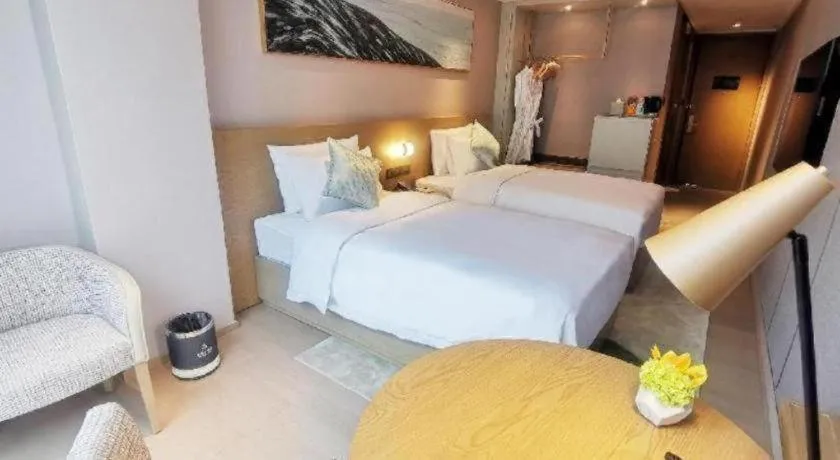 Bed in Kecheng Holiday Hotel