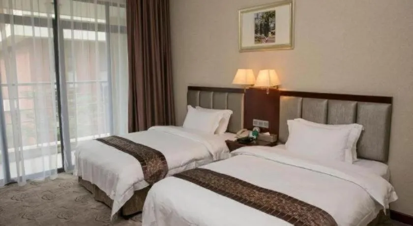 Bed in Kecheng Holiday Hotel