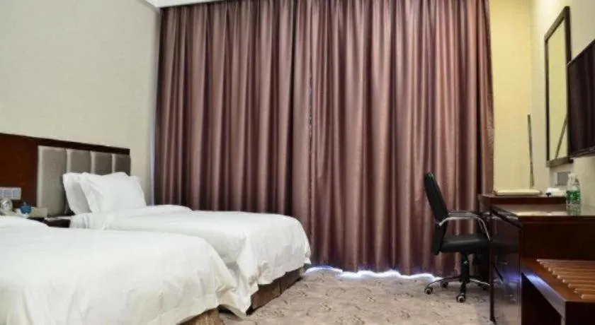 Bed in Kecheng Holiday Hotel