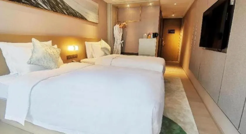 Bed in Kecheng Holiday Hotel