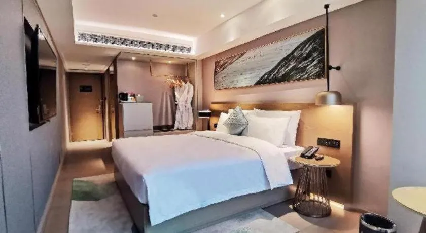 Bed in Kecheng Holiday Hotel