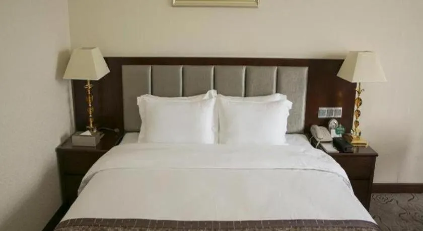 Bed in Kecheng Holiday Hotel