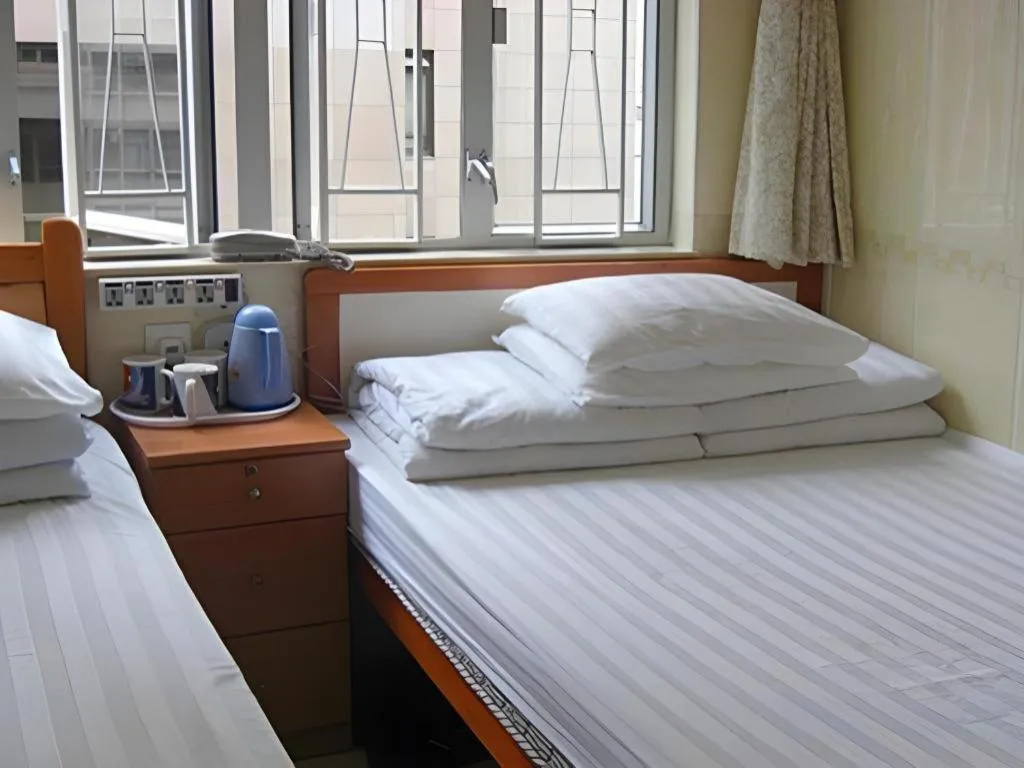 Bed in New Mong Kok Guest House