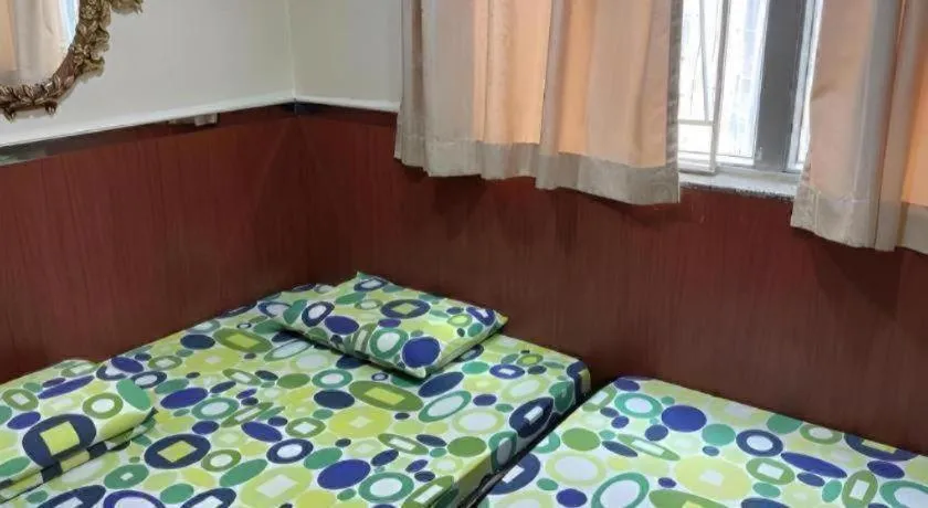 Bed in New Mong Kok Guest House