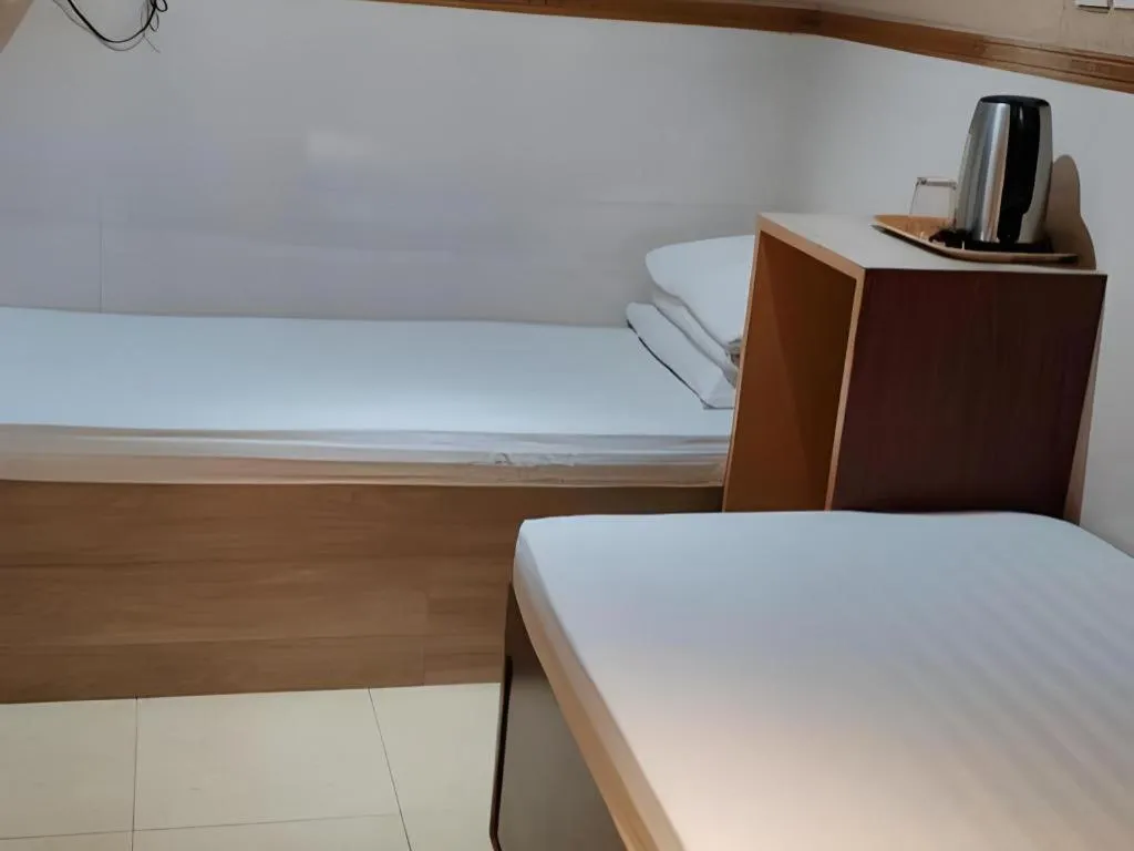 Bed in New Mong Kok Guest House