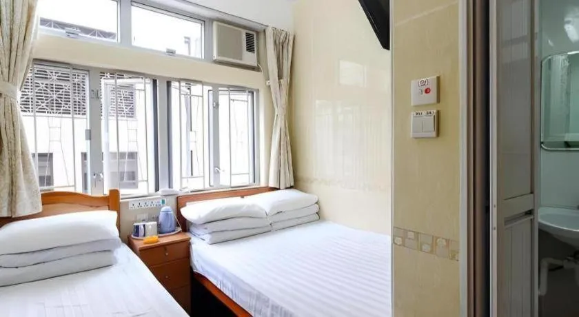 Bed in New Mong Kok Guest House