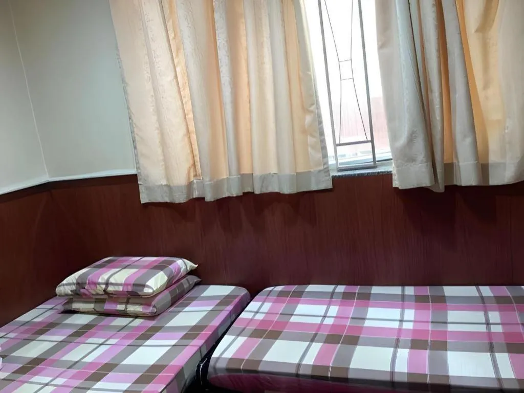 Bed in New Mong Kok Guest House
