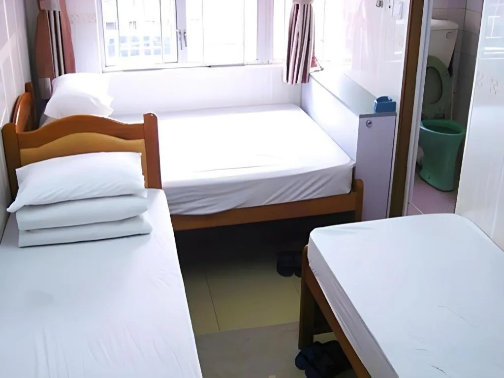 Bed in New Mong Kok Guest House