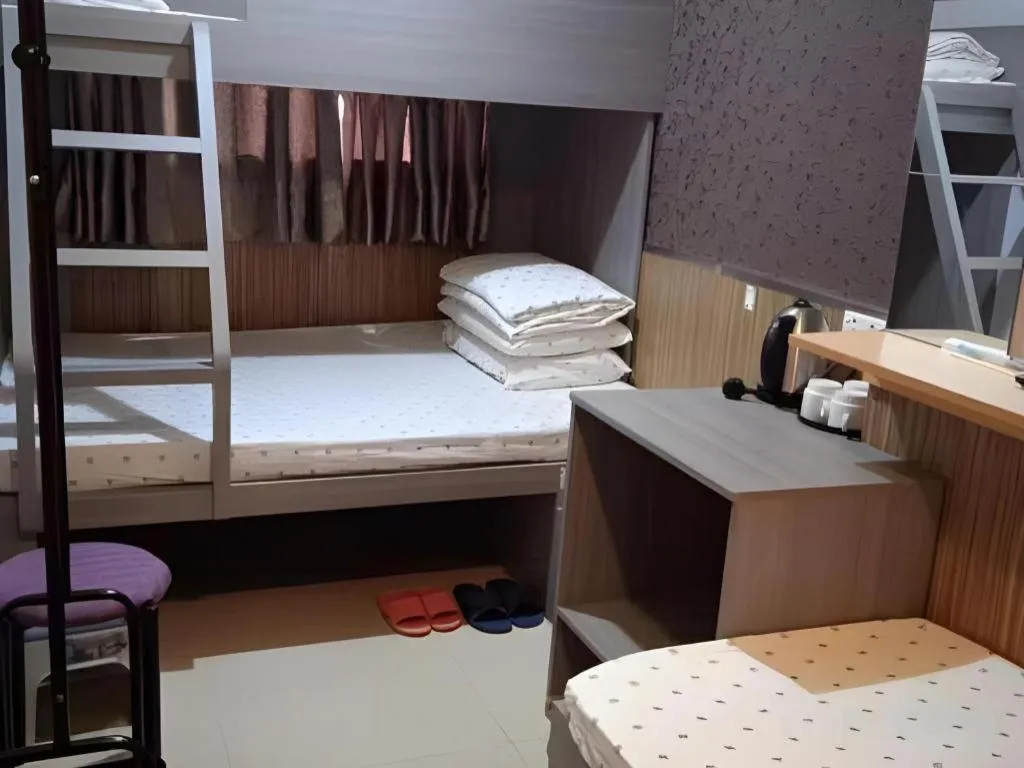 Bed in New Mong Kok Guest House