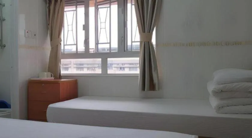 Bed in New Mong Kok Guest House