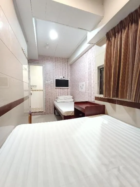 Bed in New Mong Kok Guest House