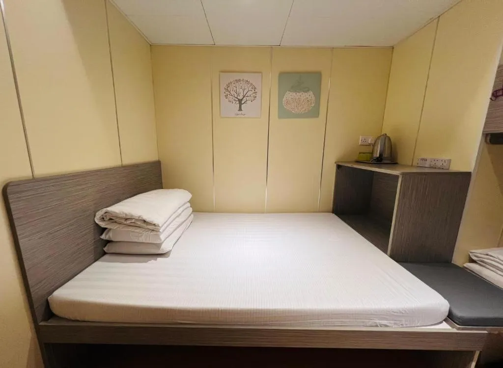 Bed in New Mong Kok Guest House