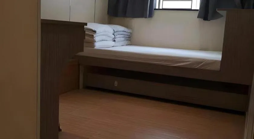 Bed in New Mong Kok Guest House