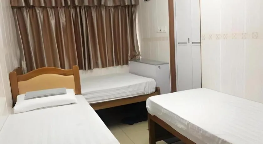 Bed in New Mong Kok Guest House