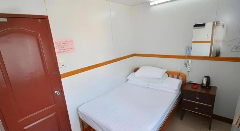 Bed in New Mong Kok Guest House