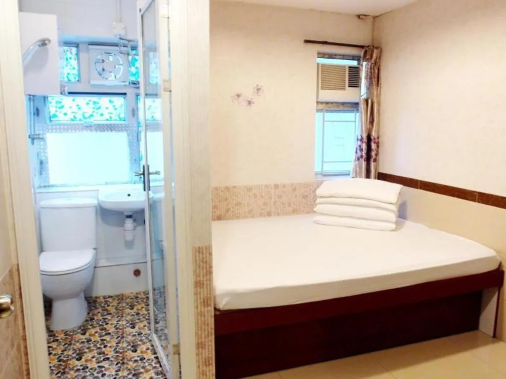 Bed in New Mong Kok Guest House