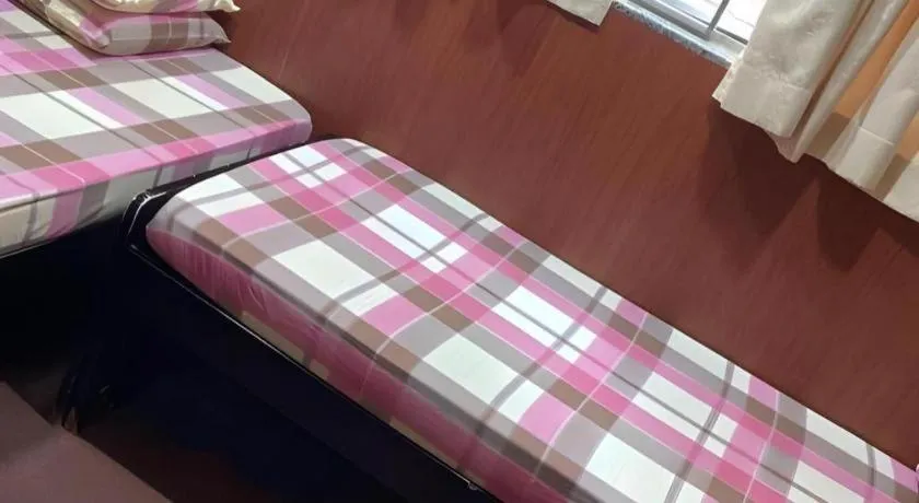 Bed in New Mong Kok Guest House