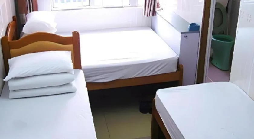 Bed in New Mong Kok Guest House