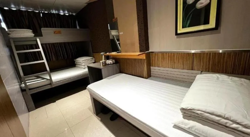 Bed in New Mong Kok Guest House