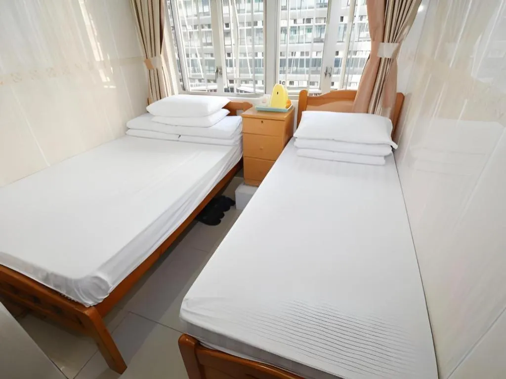 Bed in New Mong Kok Guest House