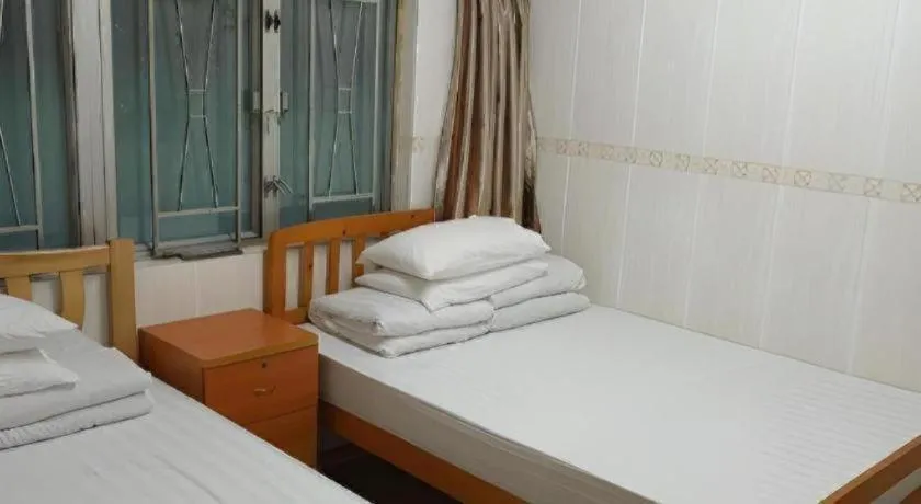 Bed in New Mong Kok Guest House
