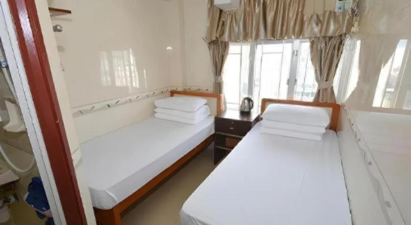 Bed in New Mong Kok Guest House