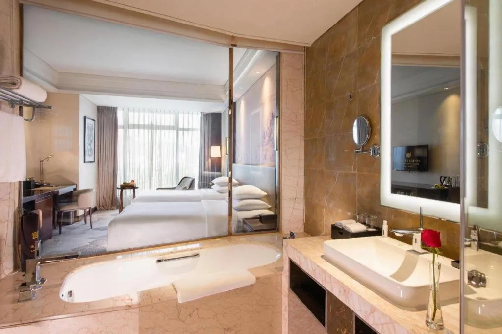 Bed in New Century Grand Hotel Hangzhou Fuyang Dongfangmao