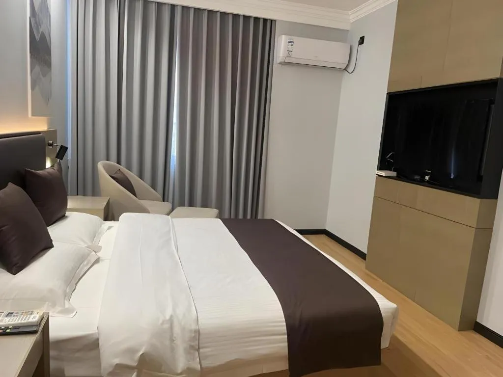 Bed in GreenTree Inn Liaoning Province Huludao City Xingcheng Shoushan Express Hotel