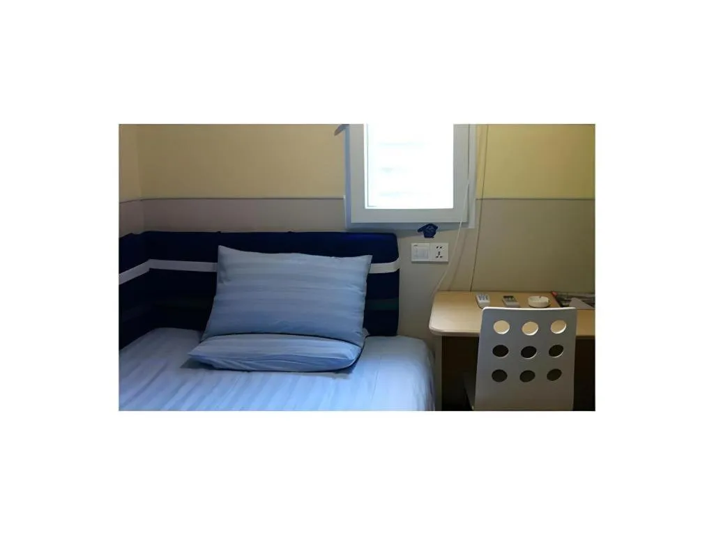 Bed in Hi Inn Guangzhou Gangding Metro Station