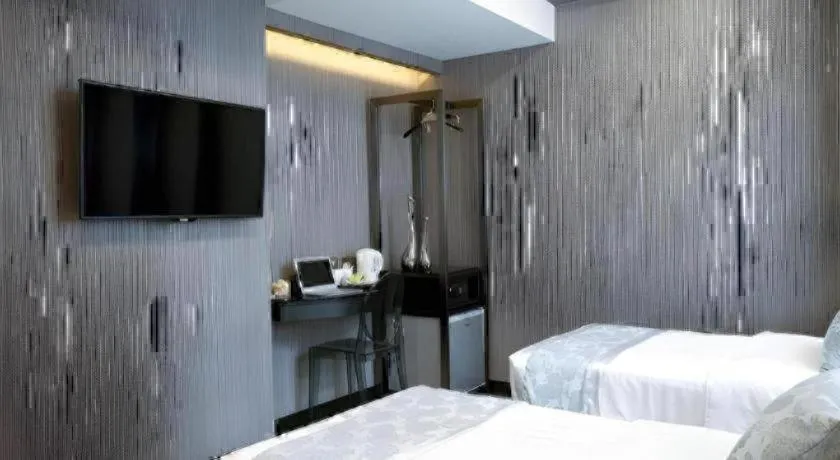 Bed in M1 North Point Hotel