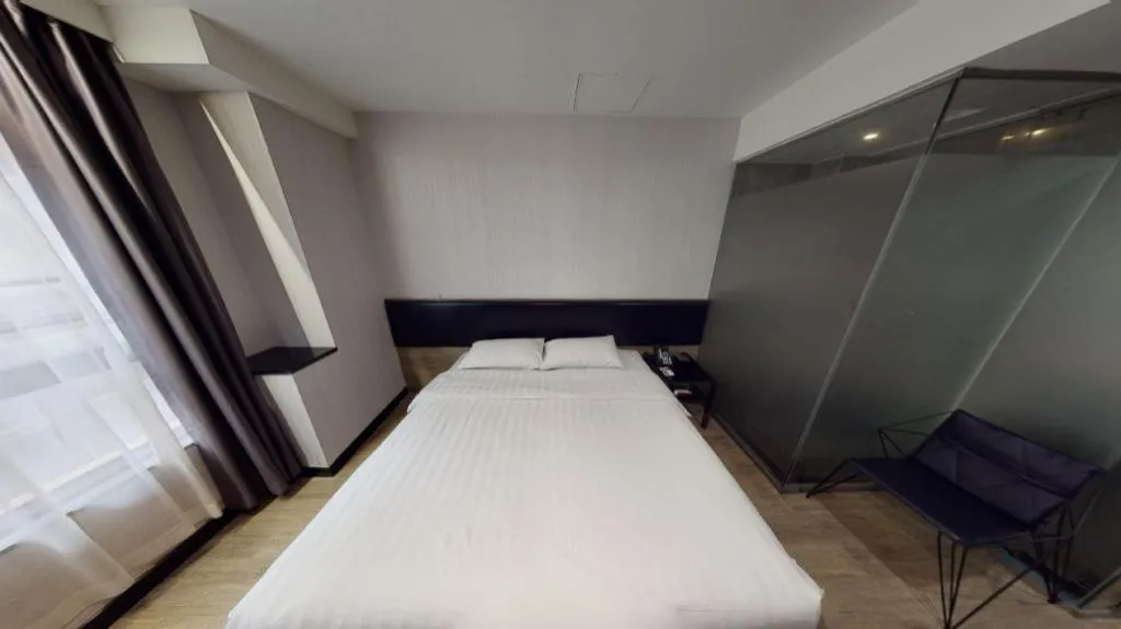 Bed in M1 North Point Hotel