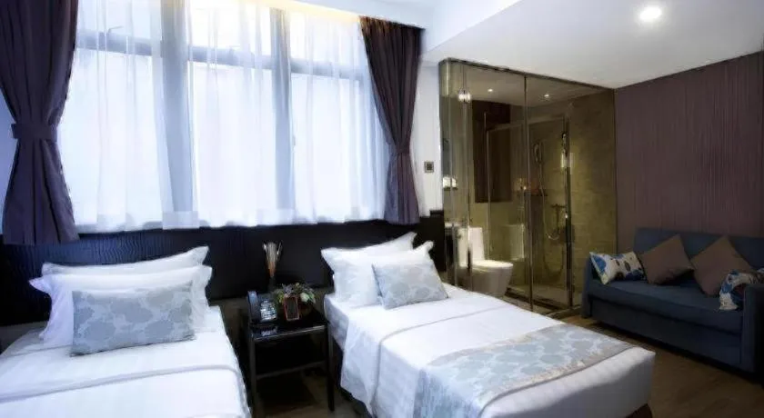 Bed in M1 North Point Hotel