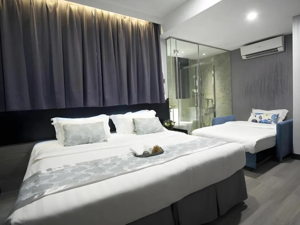 Bed in M1 North Point Hotel