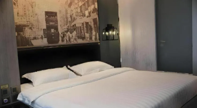 Bed in M1 North Point Hotel