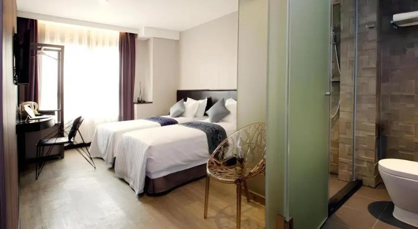 Bed in M1 North Point Hotel