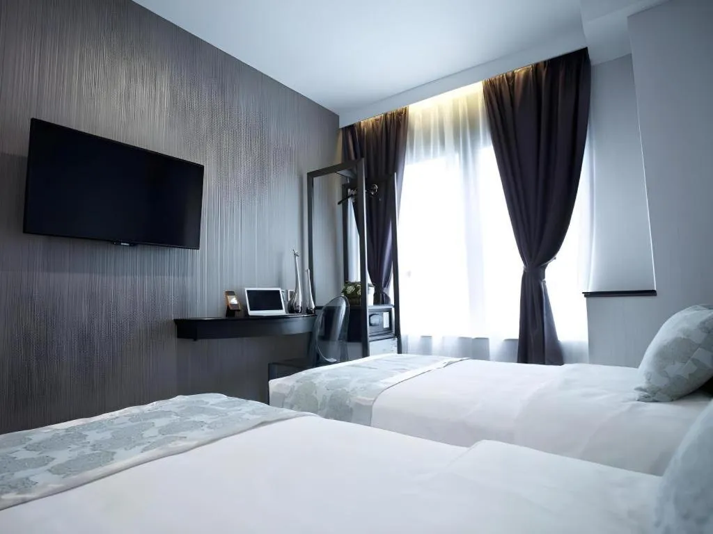 Bed in M1 North Point Hotel