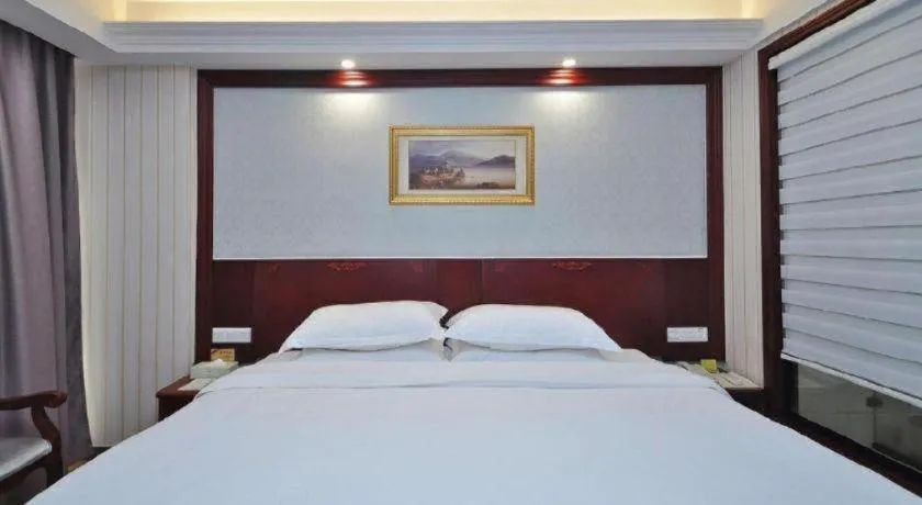 Bed in Vienna Classic Hotel Ningbo Xiangshan Wanda