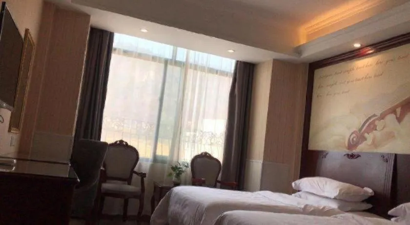 Bed in Vienna Classic Hotel Ningbo Xiangshan Wanda