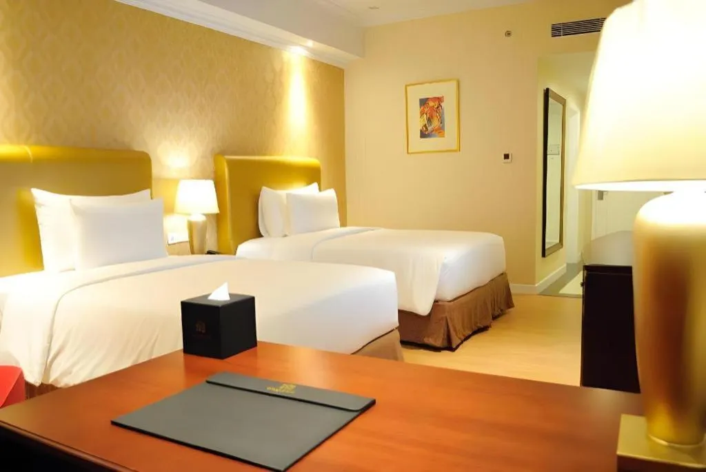 Bed in Adimulia Hotel Medan