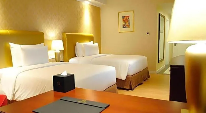 Bed in Adimulia Hotel Medan