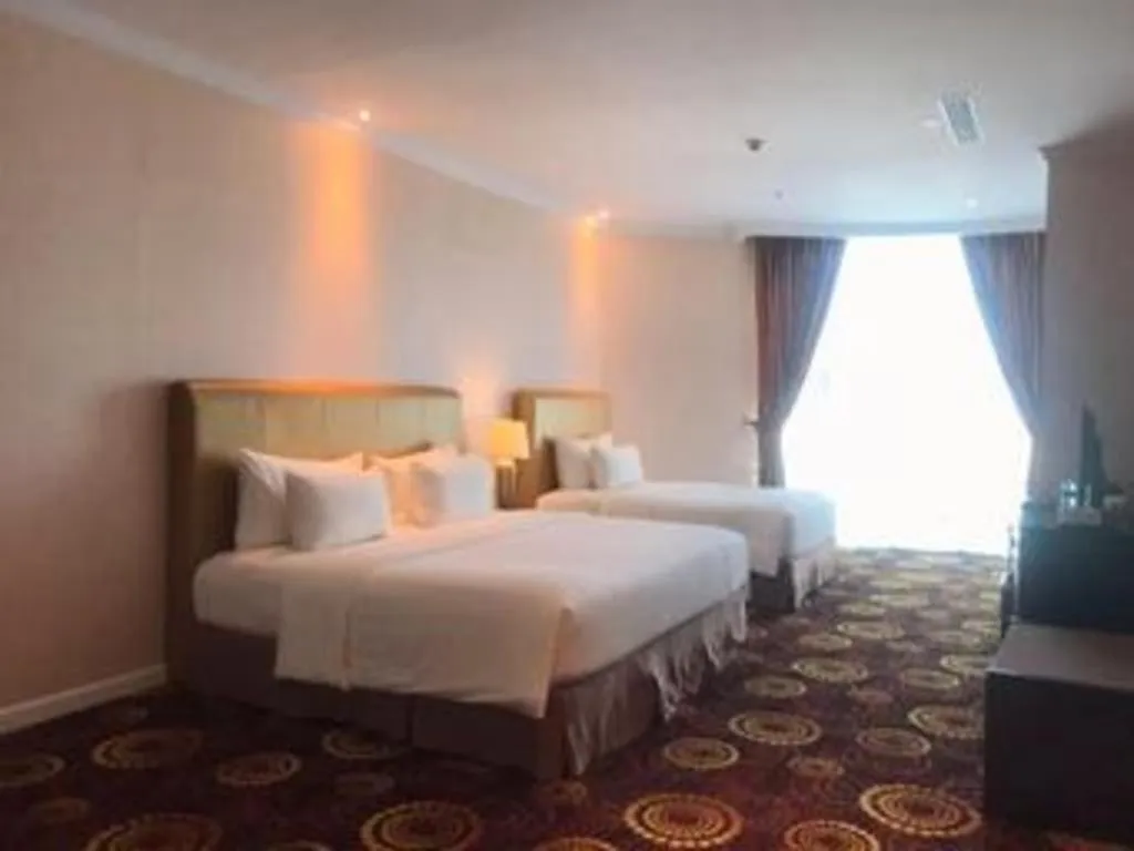 Bed in Adimulia Hotel Medan