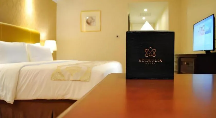 Bed in Adimulia Hotel Medan