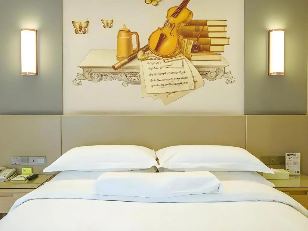 Bed in Vienna International Hotel Chengdu New Global Exhibition Center