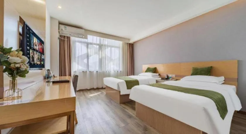 Bed in GreenTree Inn Nantong Zhangzhishan Town Deli Plaza Express Hotel