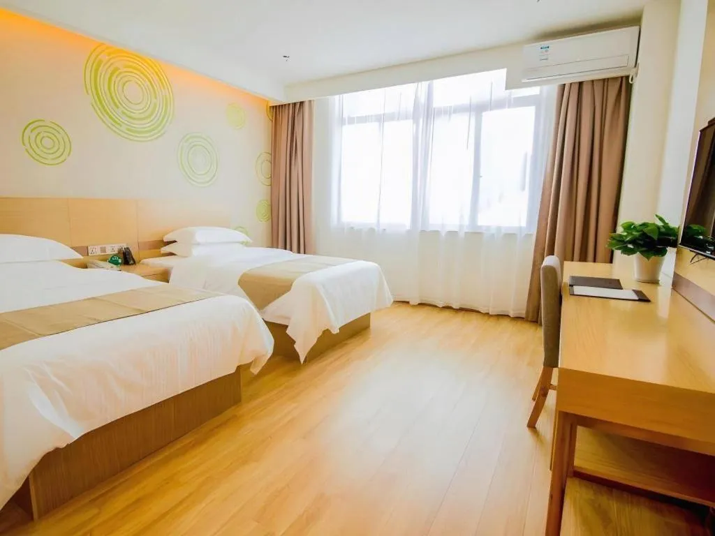 Bed in GreenTree Inn Nantong Zhangzhishan Town Deli Plaza Express Hotel